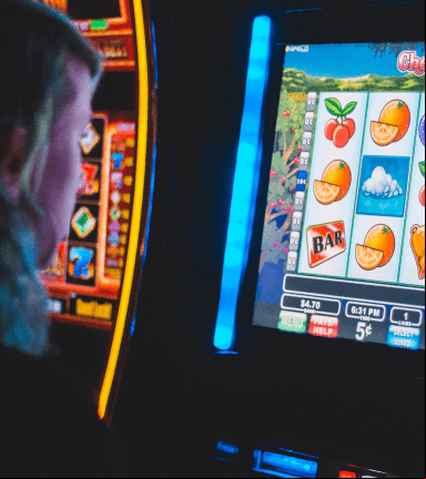 Person playing a slot machine